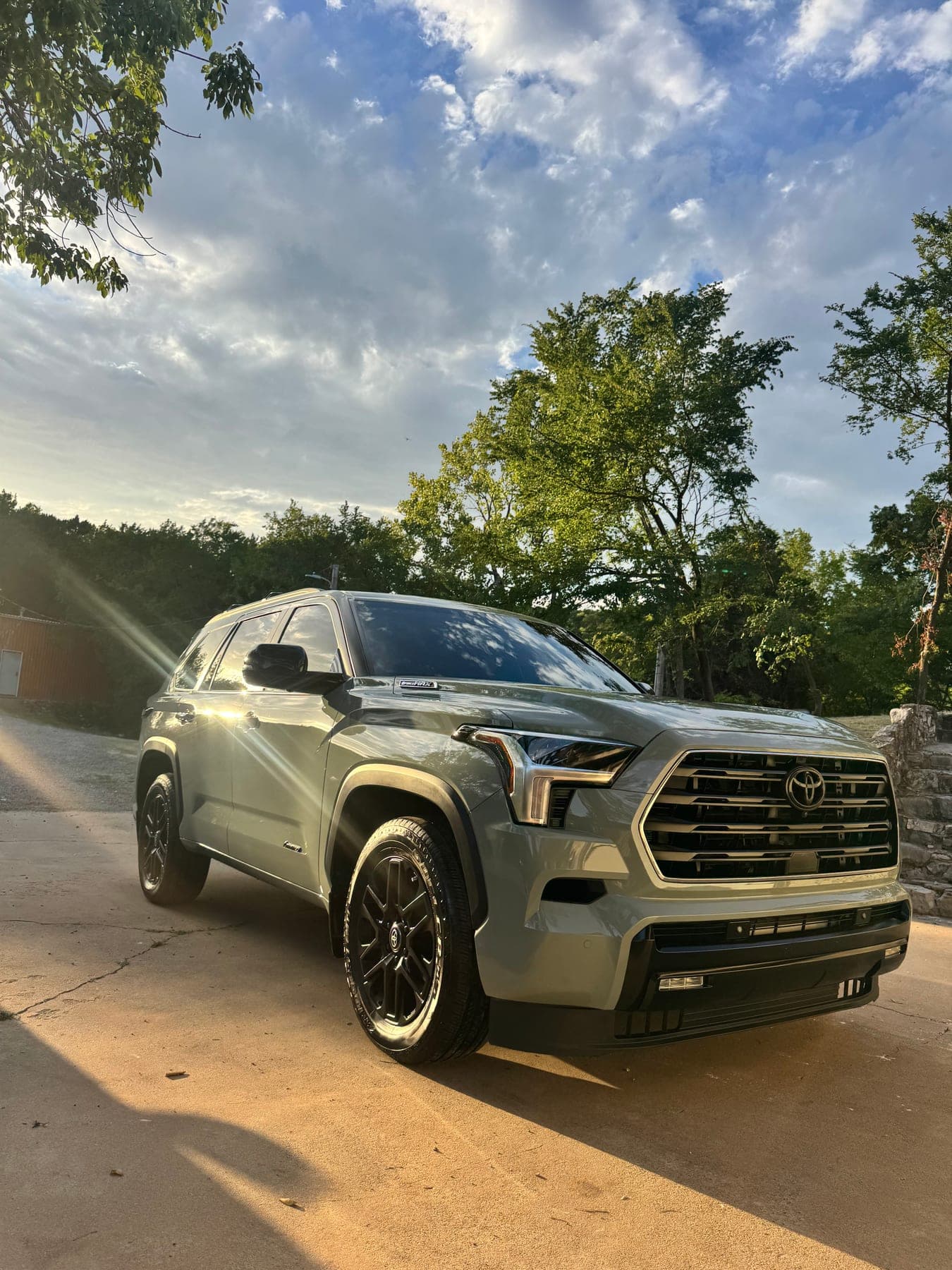A detailed silver Toyota Sequoia, front three-quarter view in evening light